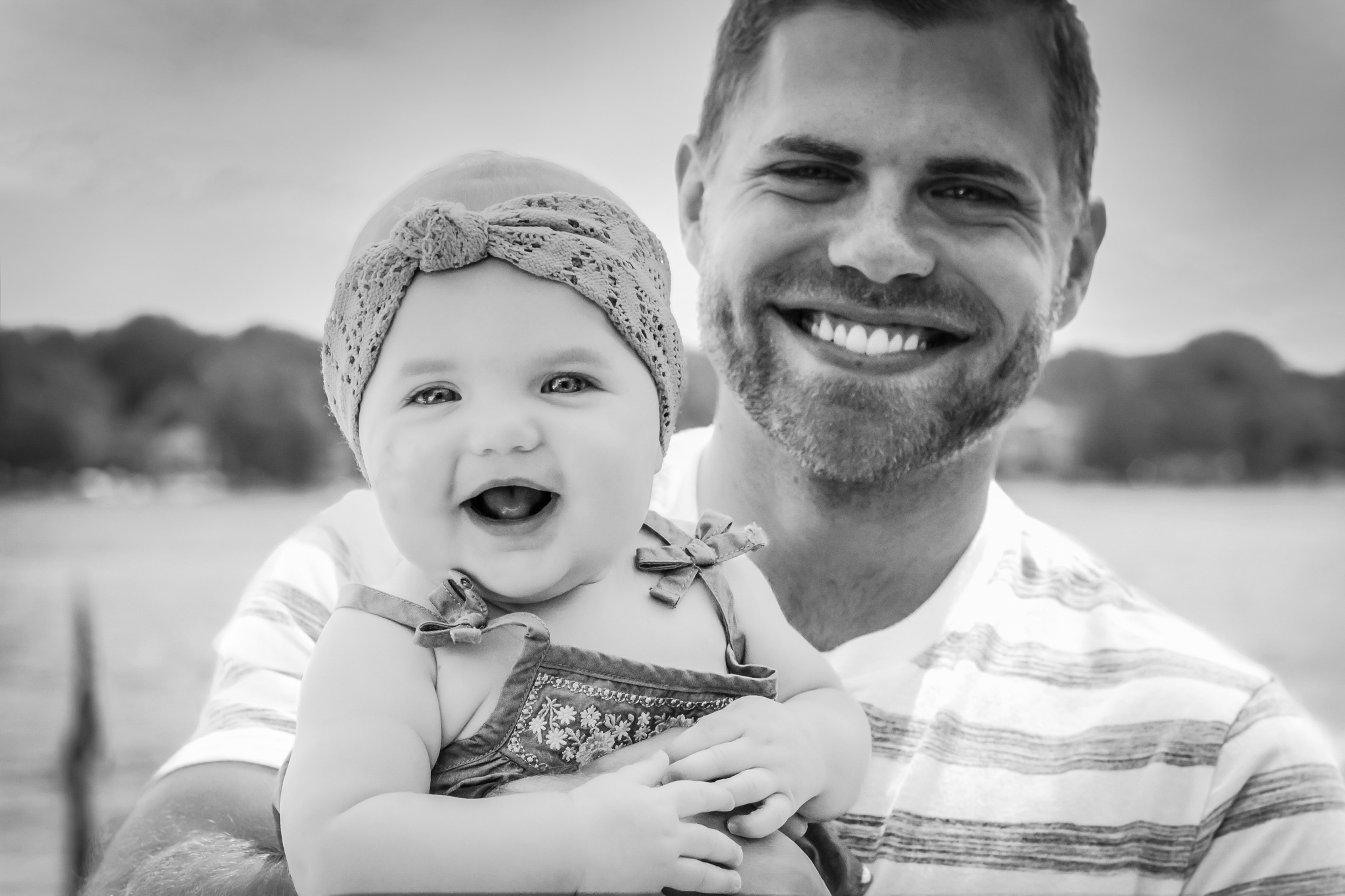 Family photographs, father and baby daughter smiling