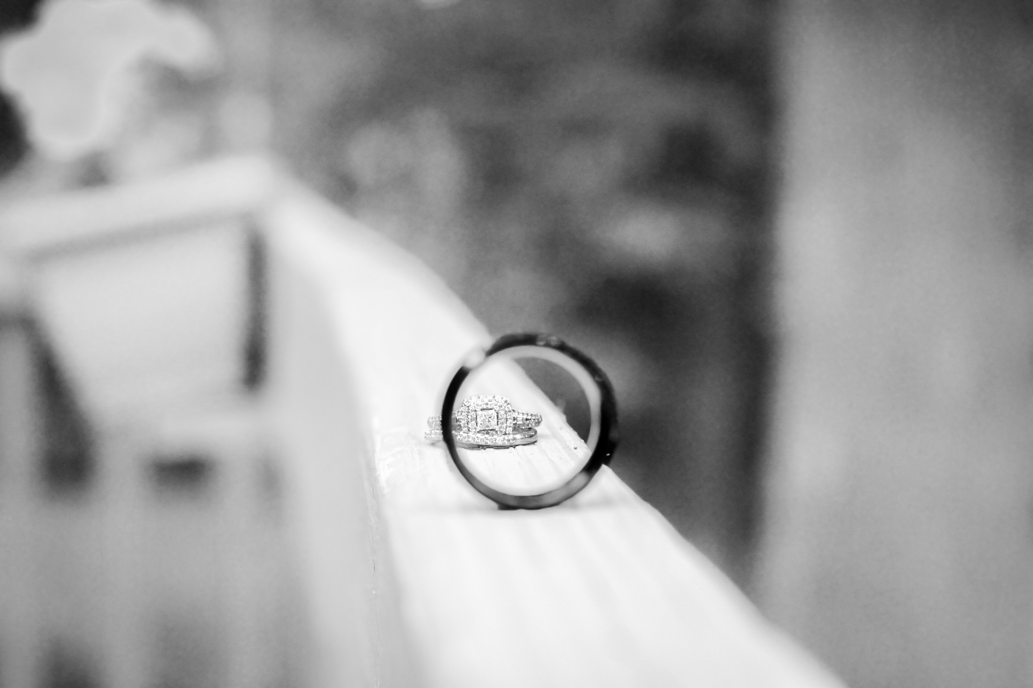 black and white photograph of wedding rings