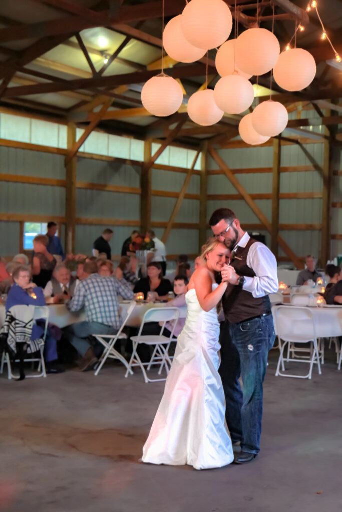 Bride and father-of-the-bride dance at reception