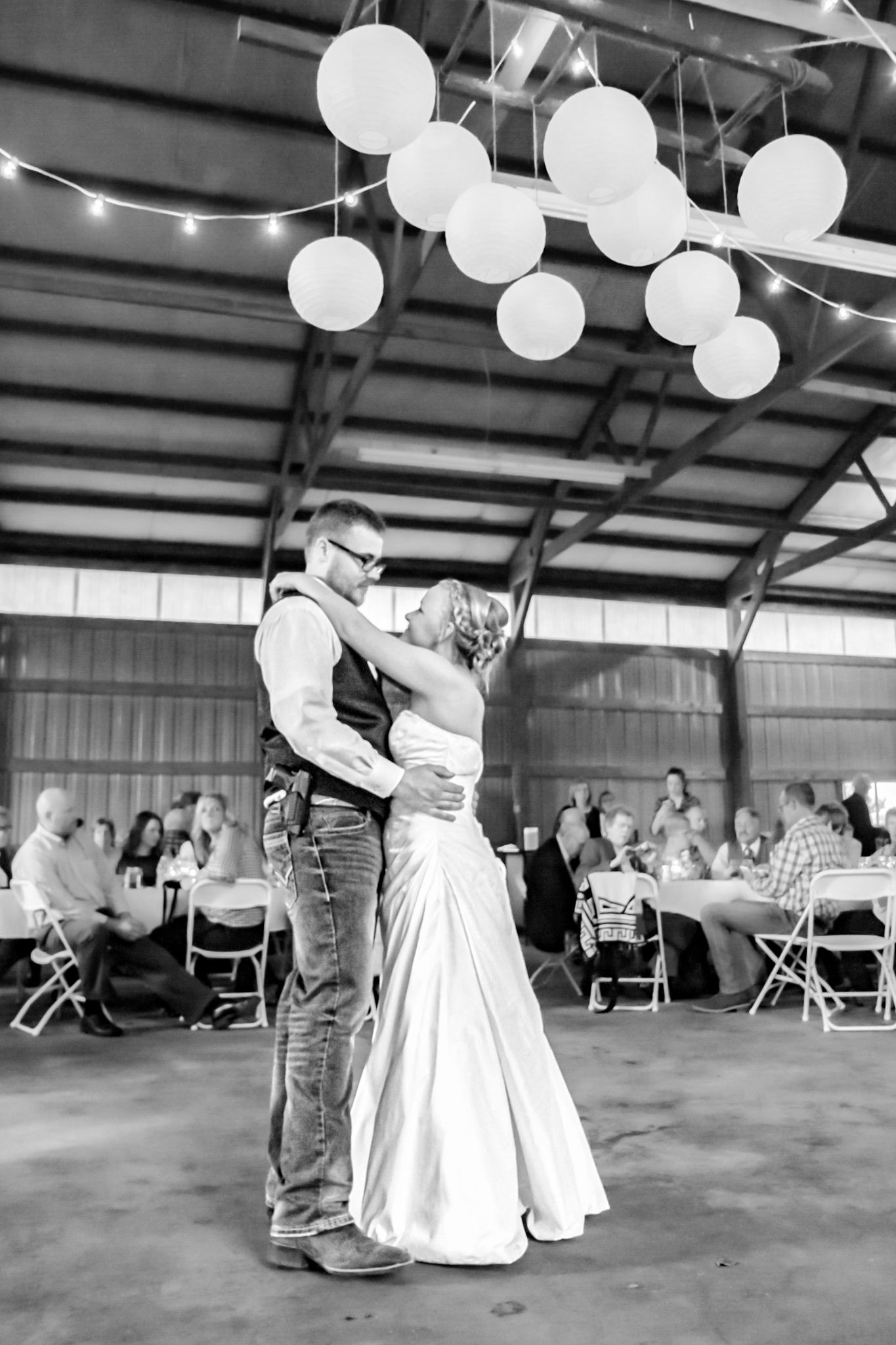 Bride and groom share first dance at reception